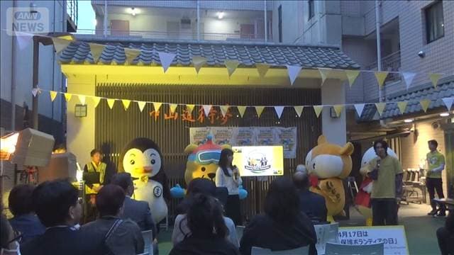 「更生保護の日」で巣鴨商店街が黄色にライトアップ