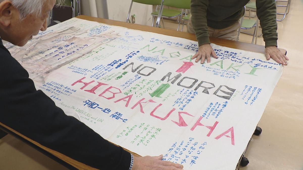 1213被災協の倉庫で横断幕を公開